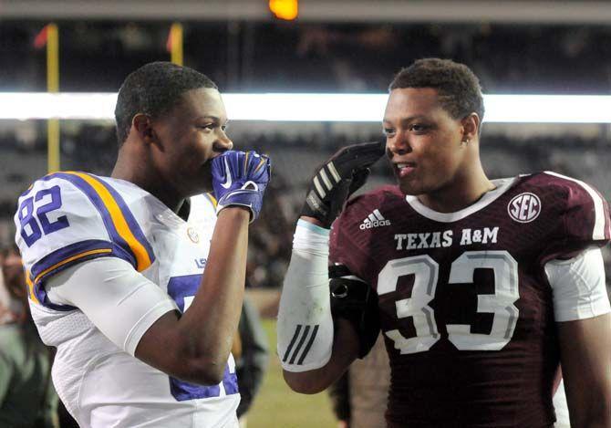 LSU freshman wide receiver, D.J. Chark (82), hangs out with Texas A&amp;M sophomore linebacker, Shaan Washington (33), after the Tiger&#8217;s 23-17 victory in Kyle Field, College Station on November 27.