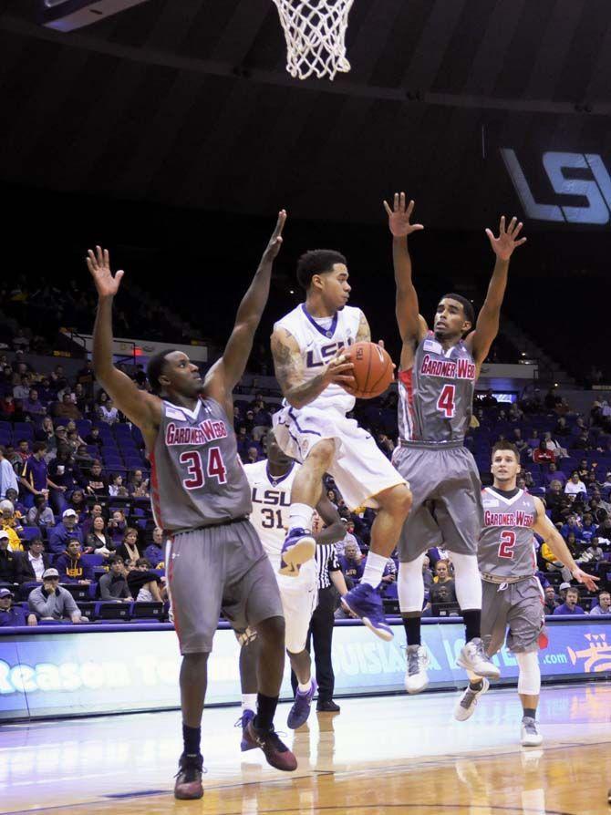 LSU junior guard Josh Gray (5) prepares to pass the ball over defending junior guard Harold McBride (4) and junior forward Jerome Hill (34) during Tigers' 93-82 victory over Gardner-Webb on Saturday, Nov. 15, 2014 in the PMAC.