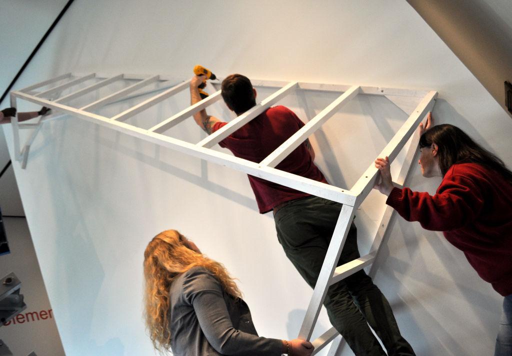 Local artist Silas Breaux works on his new installation, Dwelling, at the LSU Museum of Art on Wednesday.