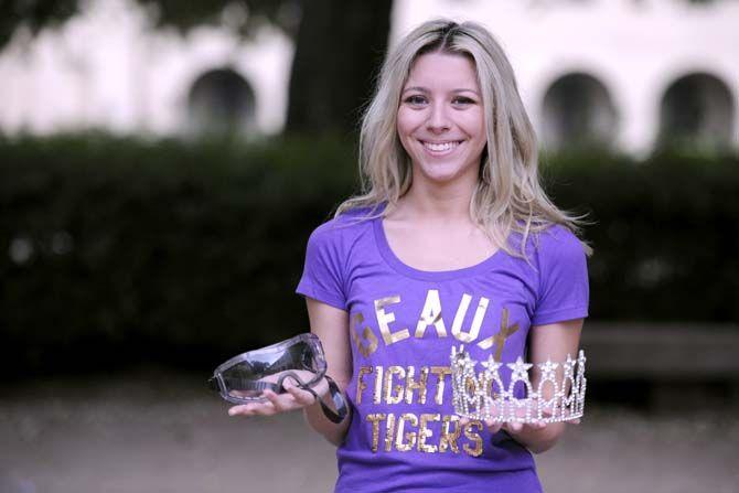 LSU chemistry senior Mariah Gewin holds her lab safety goggles and tiara. She promotes women in science while competing in pagaents such as Miss Pelican State and Miss Louisiana.