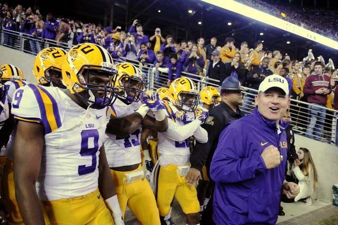 LSU head coach Les Miles comes out of the locker room and pumps up his players during the Tigers' 23-17 victory over Texas A&amp;M on Thursday, Nov.27, 2014 in Kyle field.