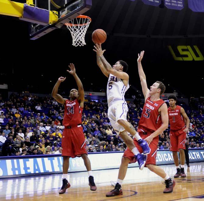 LSU junior guard Josh Gray lays up the ball during the Tigers' 69-64 OT victory against Texas Tech Tuesday, Nov. 18, 2014 in the PMAC.