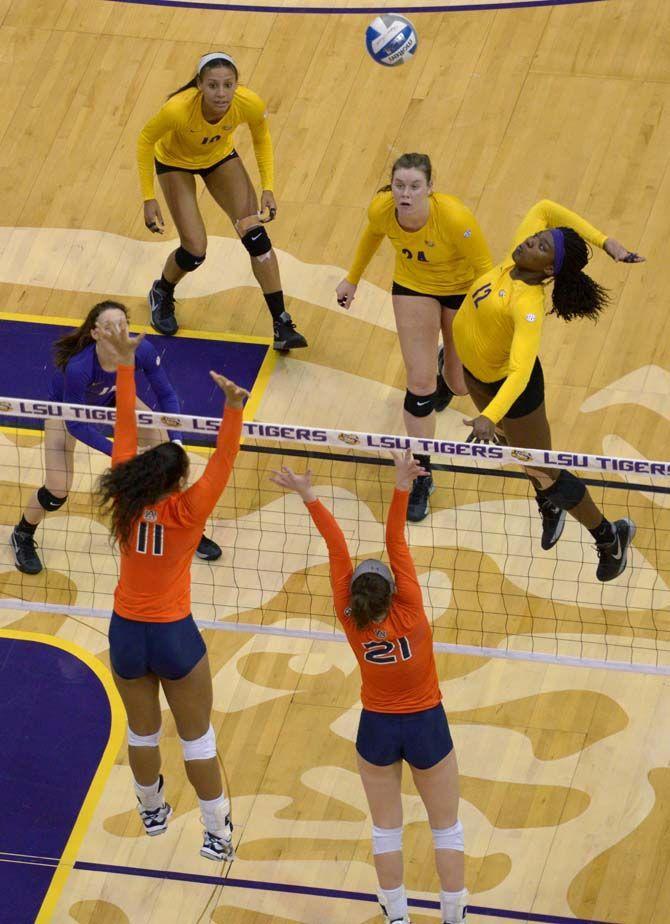 LSU freshman outside hitter Gina Tills (12) spikes the ball during the Tigers' 3-0 victory over Auburn Sunday, Nov. 23, 2014 on the PMAC.