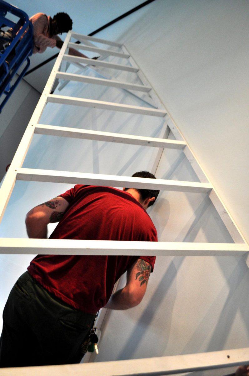 Local artist Silas Breaux works on his new installation, Dwelling, at the LSU Museum of Art on Wednesday.