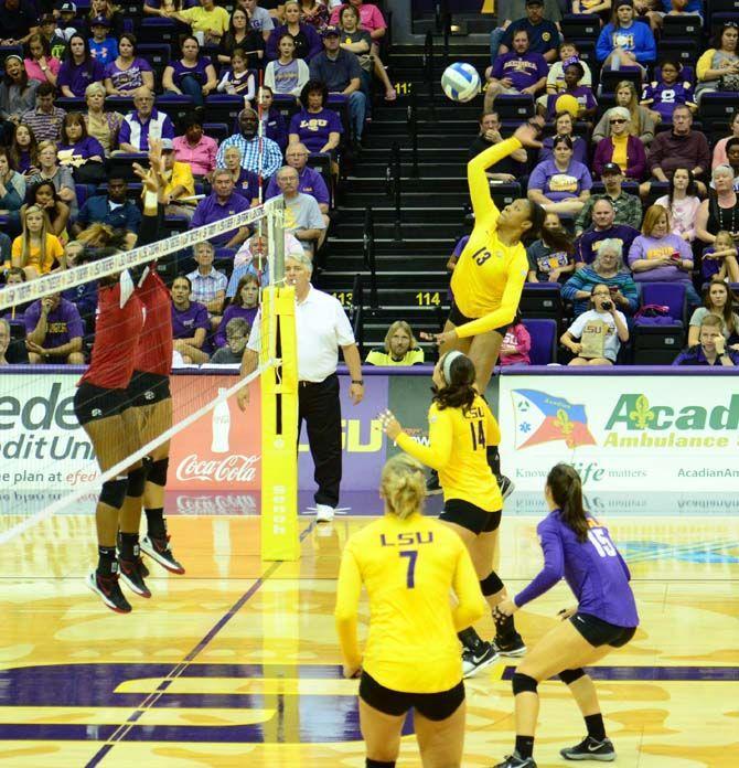 LSU's Women's Volleyball player Briana Holman (13) returns the ball in LSU vs Geogia at the PMAC on October 26, 2014.