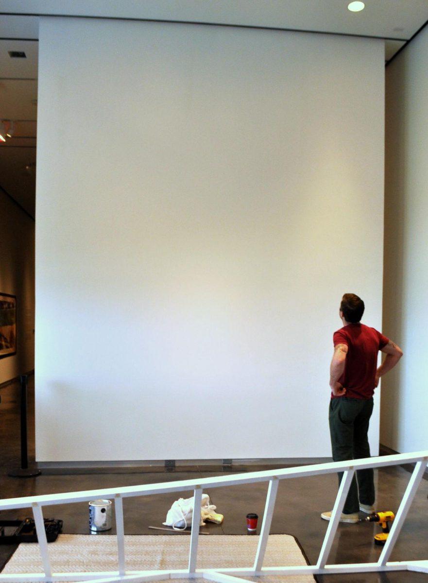 Local artist Silas Breaux works on his new installation, Dwelling, at the LSU Museum of Art on Wednesday.