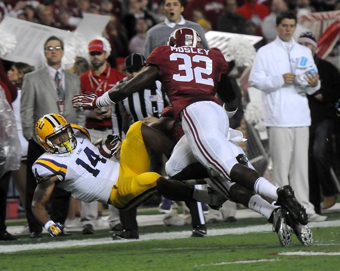 Alabama senior linebacker C.J. Mosley (32) tackles LSU junior running back Terrence Magee (14) on Saturday, Nov. 9, 2013 during the Tiger's 38-17 loss to the Alabama Crimson Tide at Bryant-Denny Stadium in Tuscaloosa, AL.