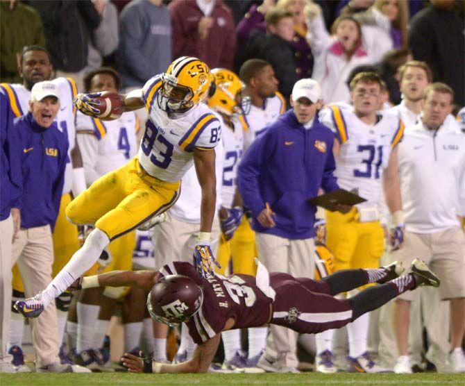 LSU sophomore Travin Dural (83) gets tackled by Texas A&amp;M senior defensive back Howard Matthews (31) during the Tigers' 23-17 victory on Thursday, Nov.27, 2014 in Kyle field.