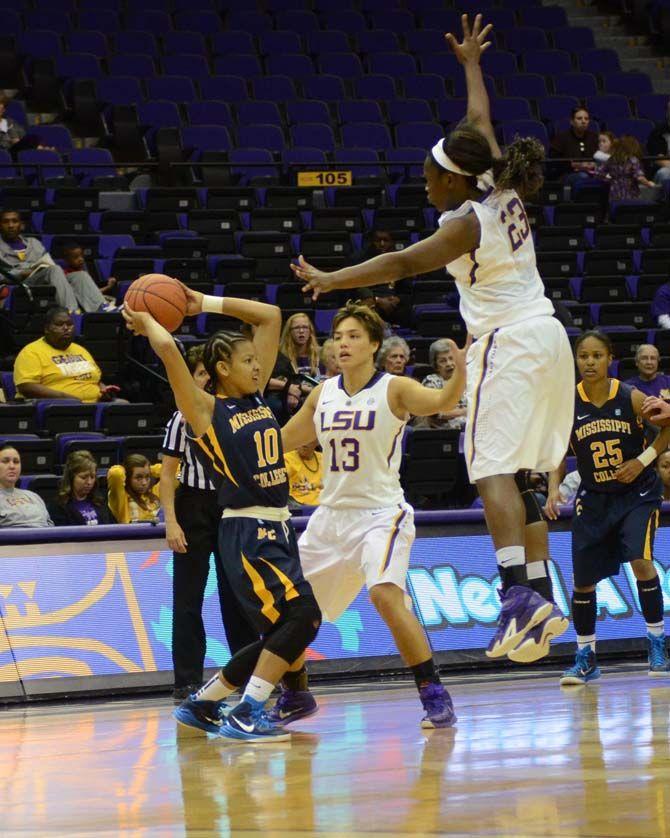 LSU So. Rian Hill (13) and Fr. Stephanie Amichia (23) attepmts to block a Mississippi College player from passing the ball to a teammate in the LSU vs Mississippi College at the PMAC Sunday November 9, 2014.