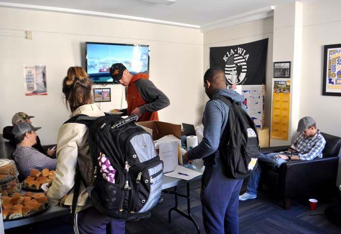 Student veterans relax, eat, and study at the Veterans Center in Hatcher Hall on Wednesday.