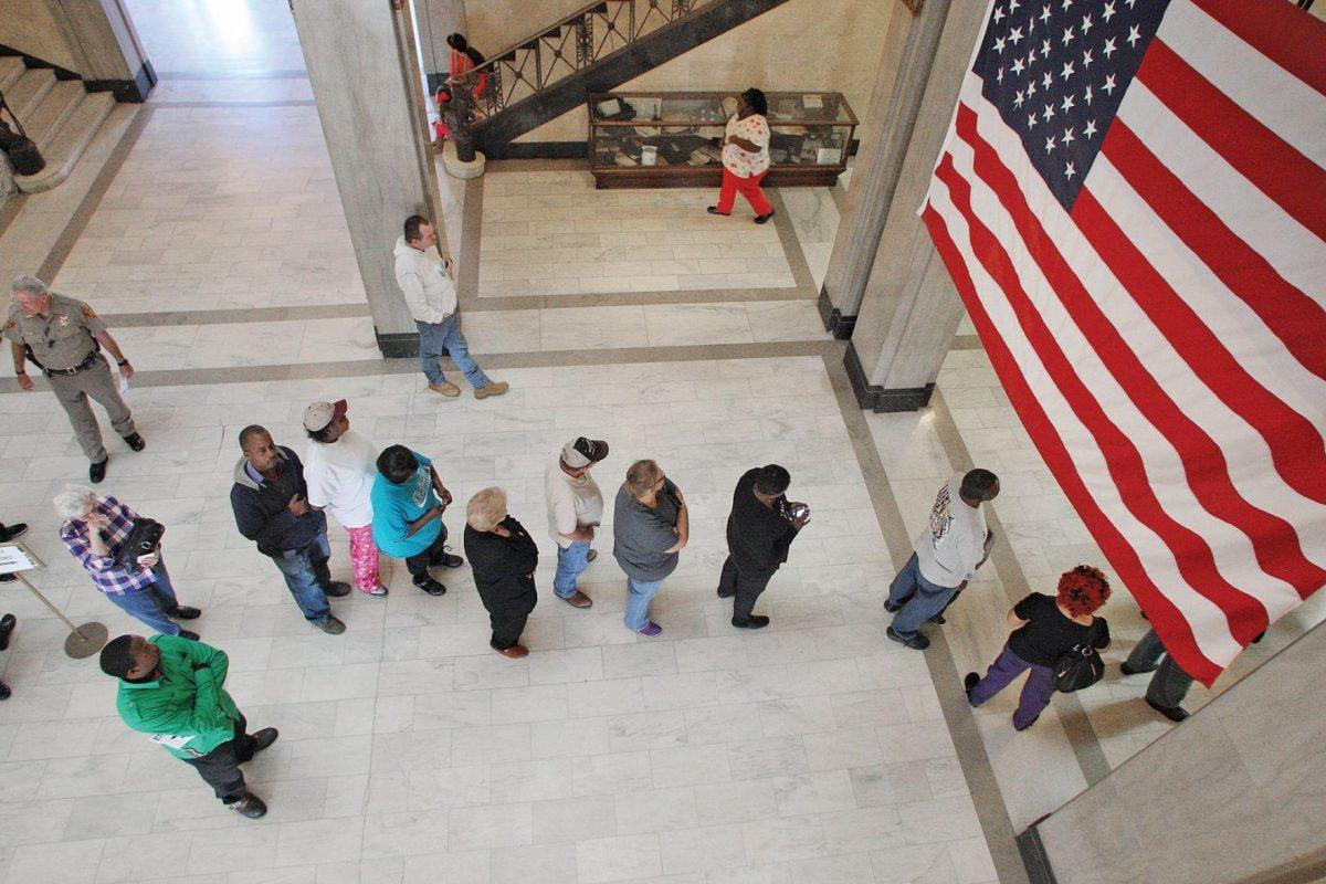 Union County residents patiently wait in line to cast their vote on the last day of early voting for the general election at the Union County Clerk in El Dorado, Ark., Monday, Nov. 3, 2014. Polls will be open from 7:30 a.m. until 7:30 p.m. today with polling sites set up throughout the county. (AP Photo/The El Dorado News-Times, Michael Orrell)