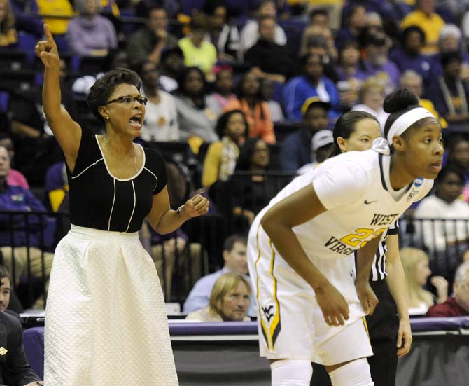 LSU head women's basketball coach Nikki Caldwell yells at her team Tuesday, March 25, 2014, during the Tigers' 76-67 win against West Virginia in the PMAC.