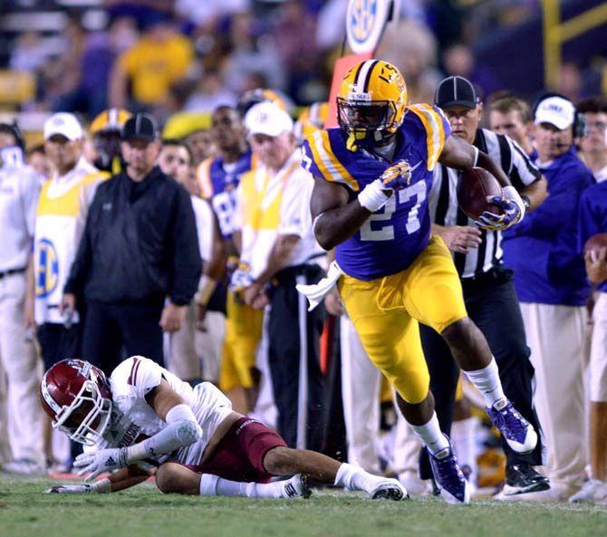 LSU senior running back Kenny Hilliard runs the ball down the field Saturday, September 27, 2014 during the Tigers' 63-7 victory against the Aggies in Tiger Stadium.