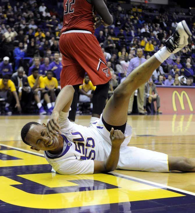 LSU sophomore guard Tim Quarterman (55) falls during the Tigers' 69-64 victory against Texas Tech Tuesday, Nov. 18, 2014 in the PMAC.