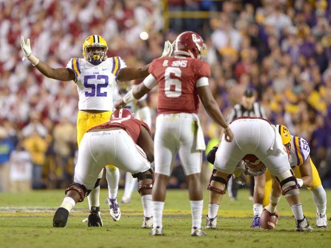 LSU sophomore linebacker Kendell Beckwith (52) pumps up the crowd during the Tigers' 20-13 loss against the Crimson Tide in Tiger Stadium.