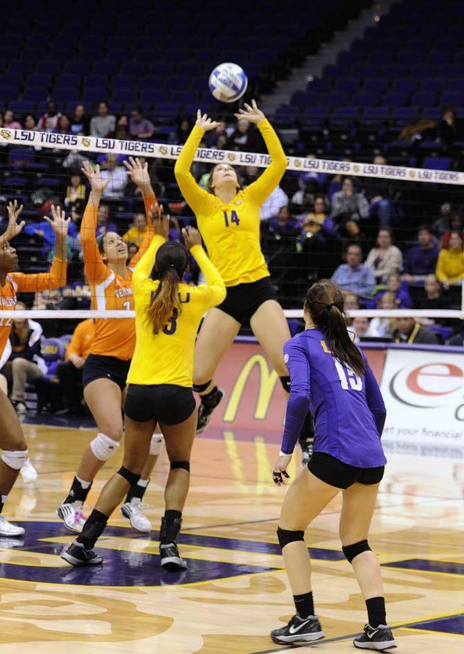 Lsu senior setter Malorie Pardo (14) sets the ball for sophomore middle blocker Briana Holman (13) during Tigers' 3-1 victory over Tennessee Friday, Oct. 14, 2014 in the PMAC