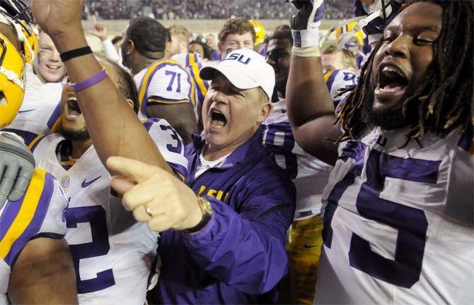 LSU head coach sings the alma during the Tigers' 23-17 victory against Texas A&amp;M on Thursday, Nov.27, 2014 in Kyle field.