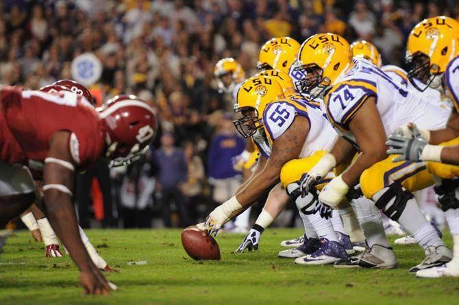 LSU senior center Elliott Porter (55) and members of the offense line up against Alabama's defense Saturday, November 8, 2014 during the Tigers' 20-13 loss against the Crimson Tide in Tiger Stadium.