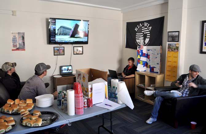 Student veterans relax, eat, and study at the Veterans Center in Hatcher Hall on Wednesday.