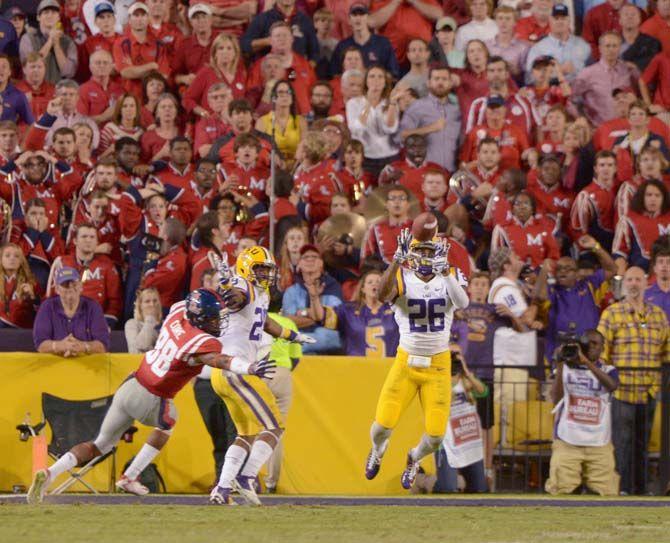 LSU senior safety Ronald Martin (26) catches the ball for a late game interception during Tigers' 10-7 victory against Ole Miss Saturday, Oct. 25, 2014 in Tiger Stadium.