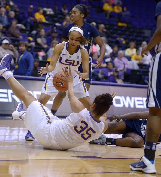 LSU freshman center/forward, Alliyah Fareo (35), passes the ball off to freshman guard, Jenna Demmer (1), before falling. LSU beat Jackson State 52-44 in the PMAC on Monday, November17, 2014.