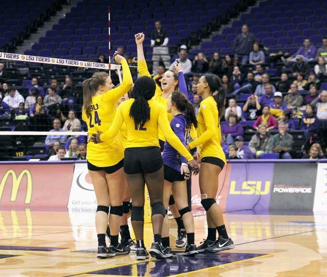 LSU volleyball team celebrates a set point during Tigers' 3-1 victory over Tennessee Friday, Oct. 14, 2014 in the PMAC