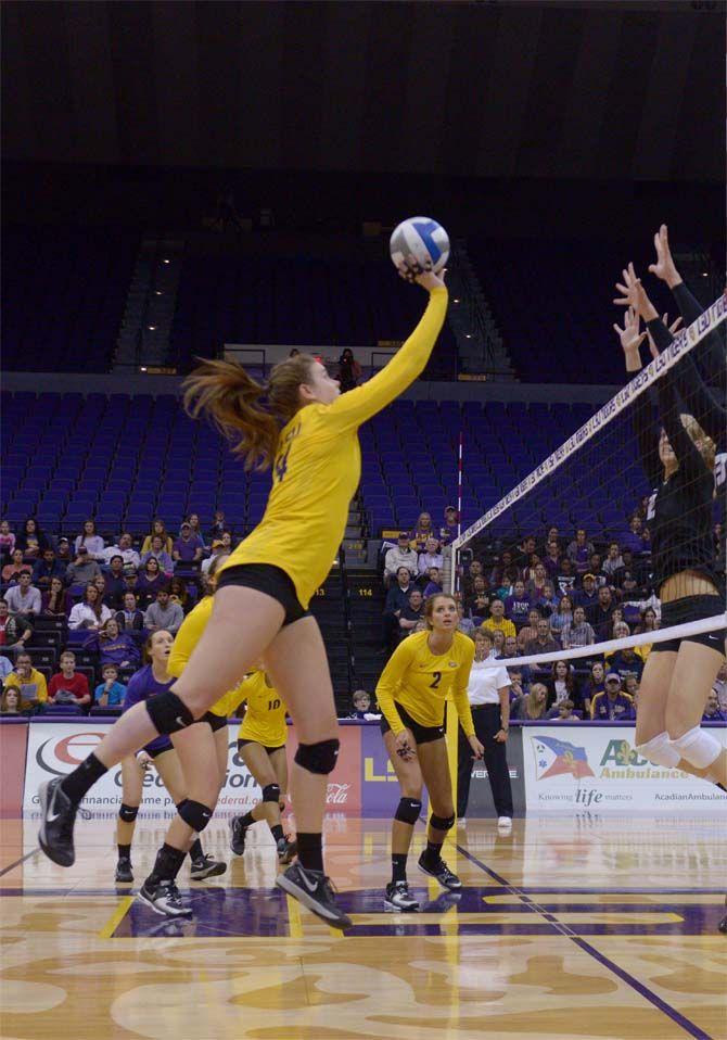 LSU junior outside hitter Cati Leak (24) jumps to hit the ball during the Tigers' 3-1 victory over Missouri Friday, Nov. 21, 2014 on the PMAC.