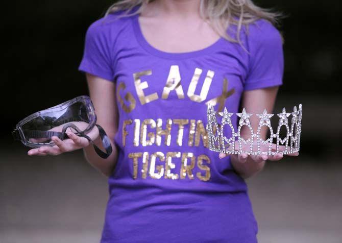 LSU chemistry senior Mariah Gewin holds her lab safety goggles and tiara. She promotes women in science while competing in pagaents such as Miss Pelican State and Miss Louisiana.