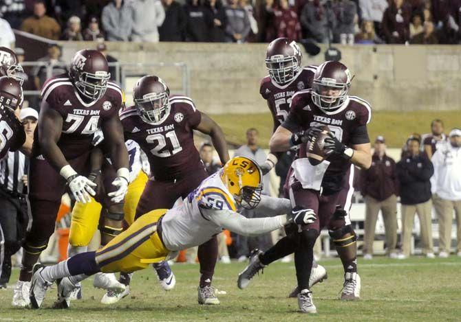 LSU senior defensive end Jermauria Rasco (59) tackles Texas A&amp;M fresman quaterback Kyle Allen (10) during the Tigers' 23-17 victory against Texas A&amp;M on Thursday, Nov.27, 2014 in Kyle field.