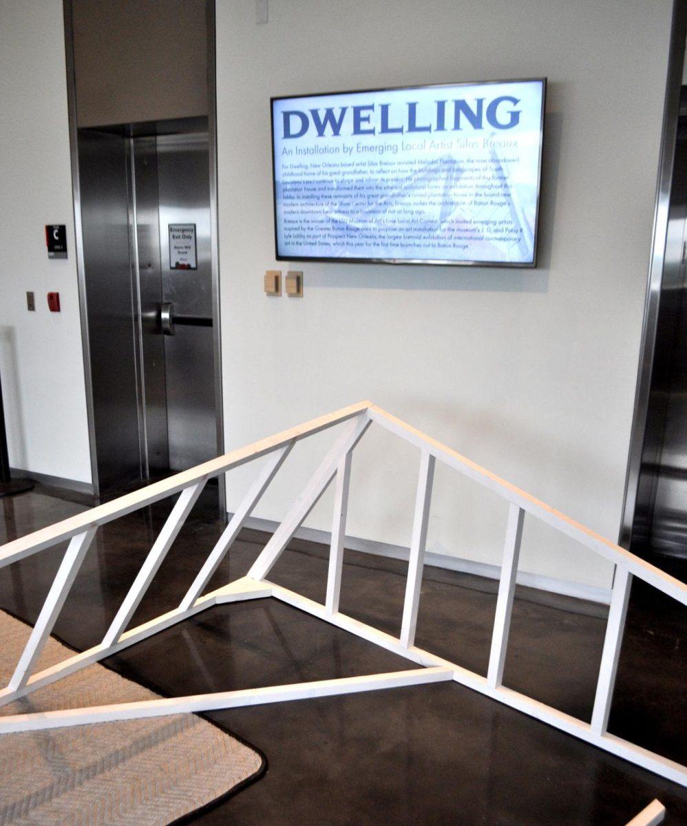 Local artist Silas Breaux works on his new installation, Dwelling, at the LSU Museum of Art on Wednesday.