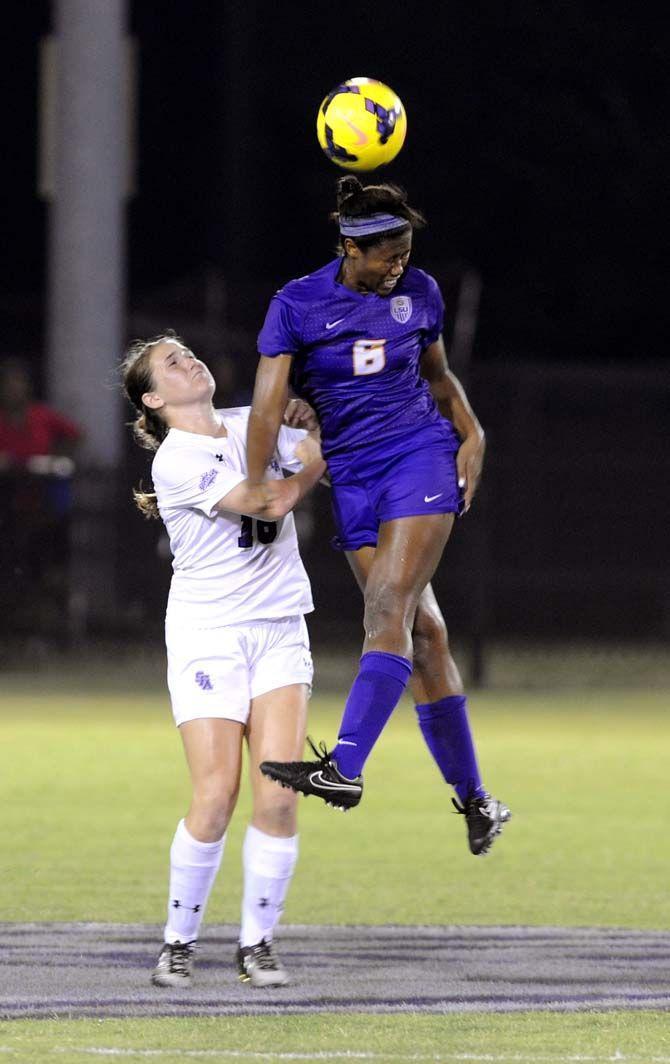 LSU midfielder Christyna Pitre head butts the ball Monday September 8, 2014 at LSU soccer stadium.