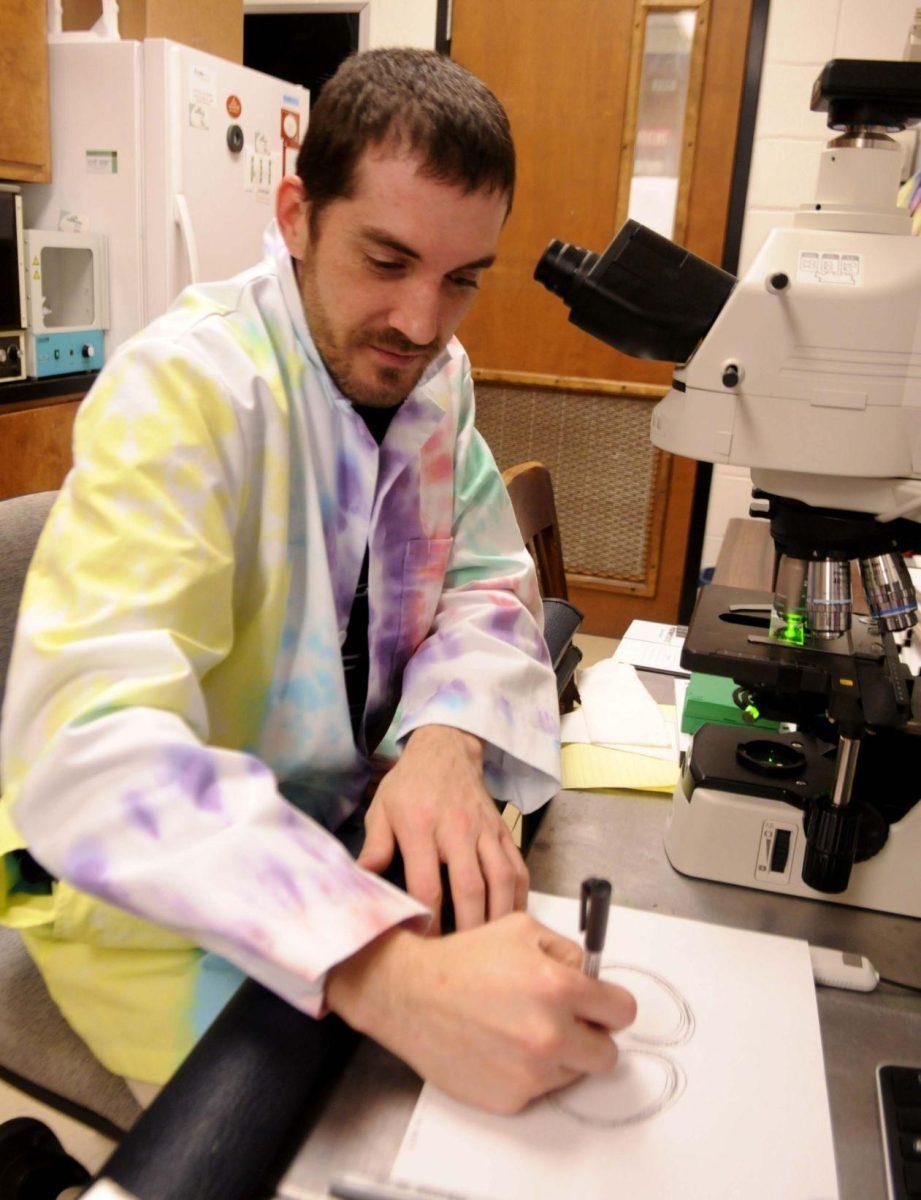 BRCC biology sophomore Ryan LeBlanc draws out images from microscopic sections of an alligator brain Wednesday Nov. 12, 2014 in the Life Science building.