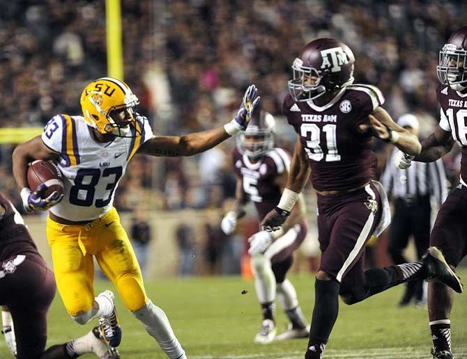 LSU sophomore wide receiver Travin Dural (83) stops senior defensive back Howard Matthews (31) during the Tigers' 23-17 victory against Texas A&amp;M on Thursday, Nov.27, 2014 in Kyle field.