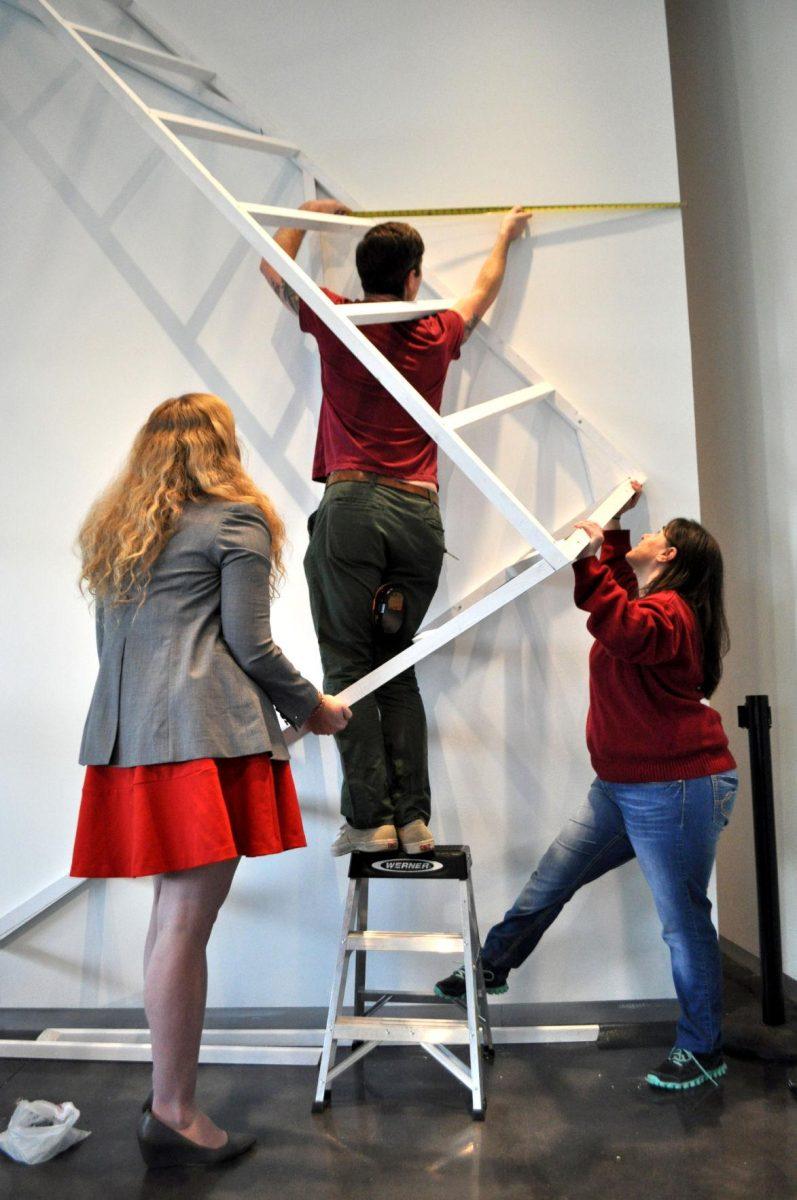 Local artist Silas Breaux works on his new installation, Dwelling, at the LSU Museum of Art on Wednesday.