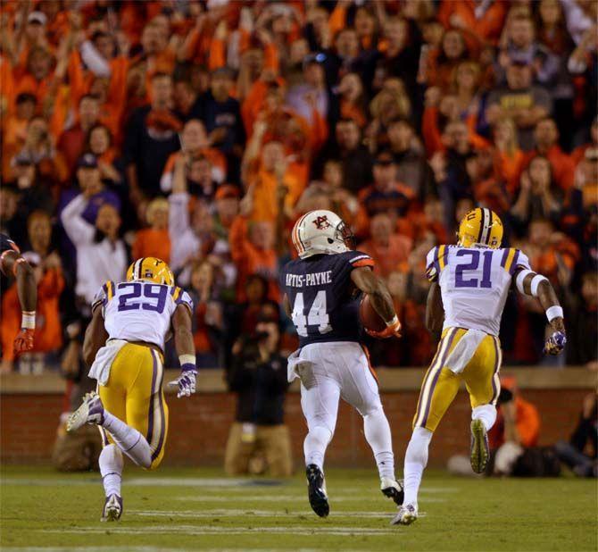 LSU sophomore safety Rickey Jefferson (29) and sophomore defensive back Rashard Robinson chase after Auburn senior running back Cameron Artis-Payne (44) Saturday, October 4, 2014 during the LSU Tigers' 41-7 loss against the Auburn Tigers in Jordan-Hare Stadium.