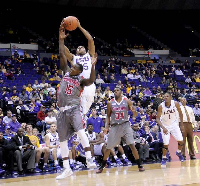 LSU freshman guard Jalyn Patterson (15) picks up a rebound over redshirt senior guard Jarvis Davis (15) during Tigers' 93-82 victory over Gardner-Webb on Saturday, Nov. 15, 2014 in the PMAC.