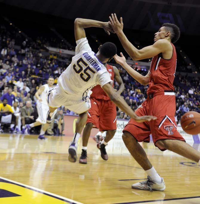 LSU sophomore guard Tim Quarterman (55) falls during the Tigers' 69-64 victory against Texas Tech Tuesday, Nov. 18, 2014 in the PMAC