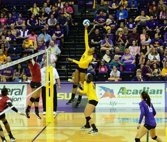 LSU's Women's Volleyball player Briana Holman (13) returns the ball in LSU vs Geogia at the PMAC on October 26, 2014.