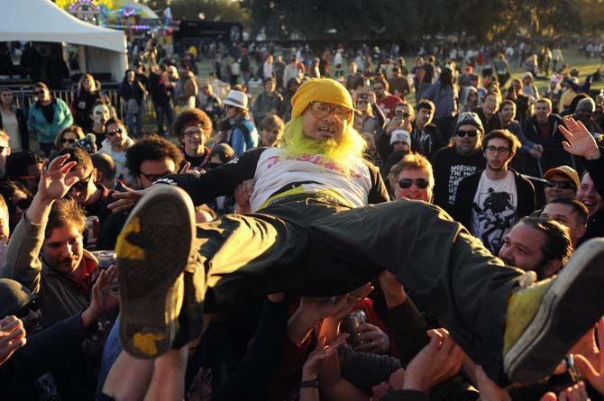 Lead sinnger Peelander-Yellow from Peelander-Z surfs the crowd prior to his performance at Carnival stage during Voodoo Fest Saturday, November 1, 2014 in New Orleans Louisiana.