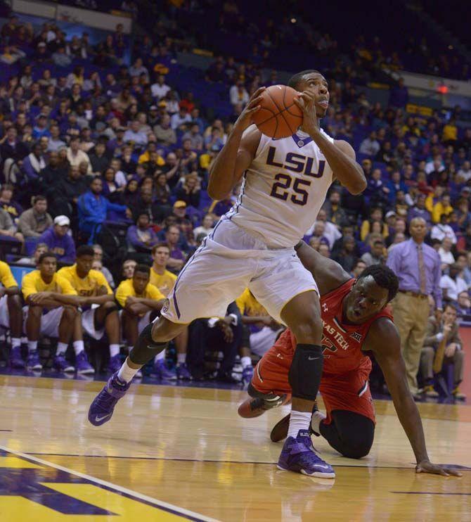 LSU sophomore forward Jordan Mickey (25) lays up the ball during the Tigers' 69-64 victory against Texas Tech Tuesday, Nov. 18, 2014 in the PMAC