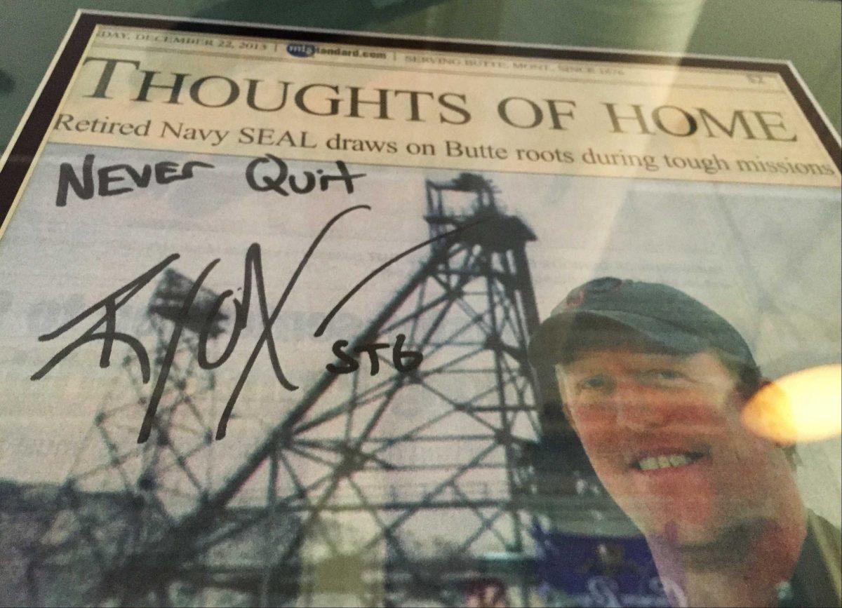 A framed Montana Standard newspaper article on Robert O'Neill of Butte, Mont., signed by O'Neill, is seen on the wall of the Metals Sports Bar in Butte on Thursday, Nov. 6, 2014. O'Neill, a Butte native and ex-Navy SEAL, told The Washington Post that he fired the shots that killed Osama bin Laden, a story he first recounted in February to Esquire magazine, which identified him only as "the shooter." One current and one former SEAL confirmed to The Associated Press that O'Neill was long known to have fired the fatal shots at the al-Qaida leader. The article is signed, "Never Quit." (AP Photo/Lisa Baumann)