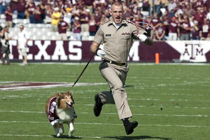 Texas A&amp;M mascot Reveille VIII runs with her Texas A&amp;M Corps sophomore handler Daylon Koster across the field on Saturday, Oct. 20, 2012 before the LSU vs Texas A&amp;M game at Kyle Field in College Station, Texas.