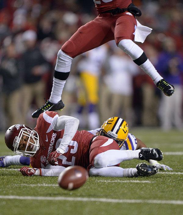 The ball is fumbled in Tigers' losing game against Arkansas 17-0 Saturday, Nov. 15, 2014 in Donald W. Reynolds Razorback Stadium.