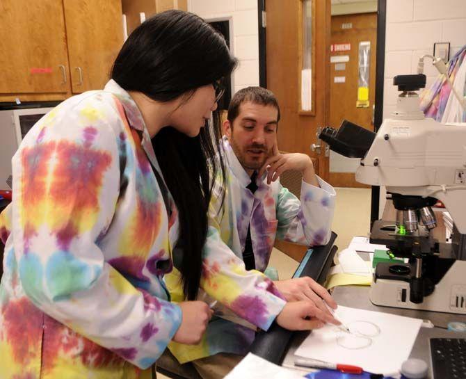 LSU biochemistry senior Katie Huang and BRCC biology sophomore Ryan LeBlanc draw out images from the microscopic sections of an alligator brain Wednesday Nov. 12, 2014 in the Life Science building.