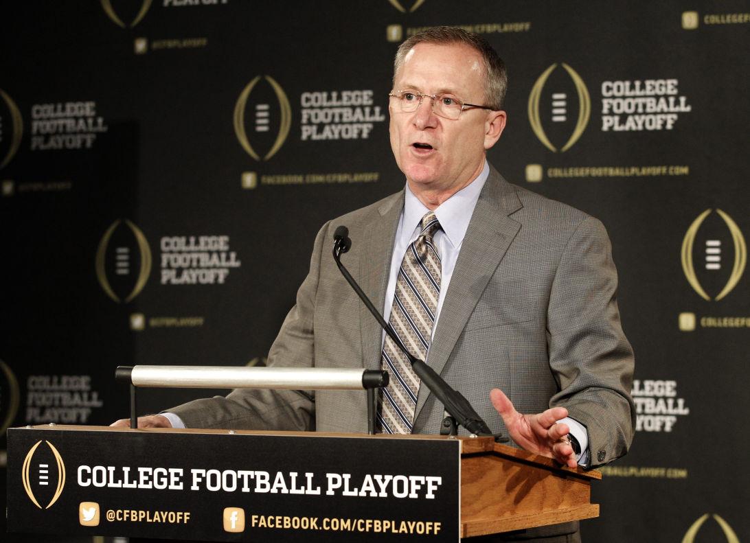 FILE - In this Oct. 16, 2013, file photo, College Football Playoff selection committee chairman and Arkansas athletic director Jeff Long responds to questions during a news conference in Irving, Texas. (AP Photo/Tony Gutierrez, File)