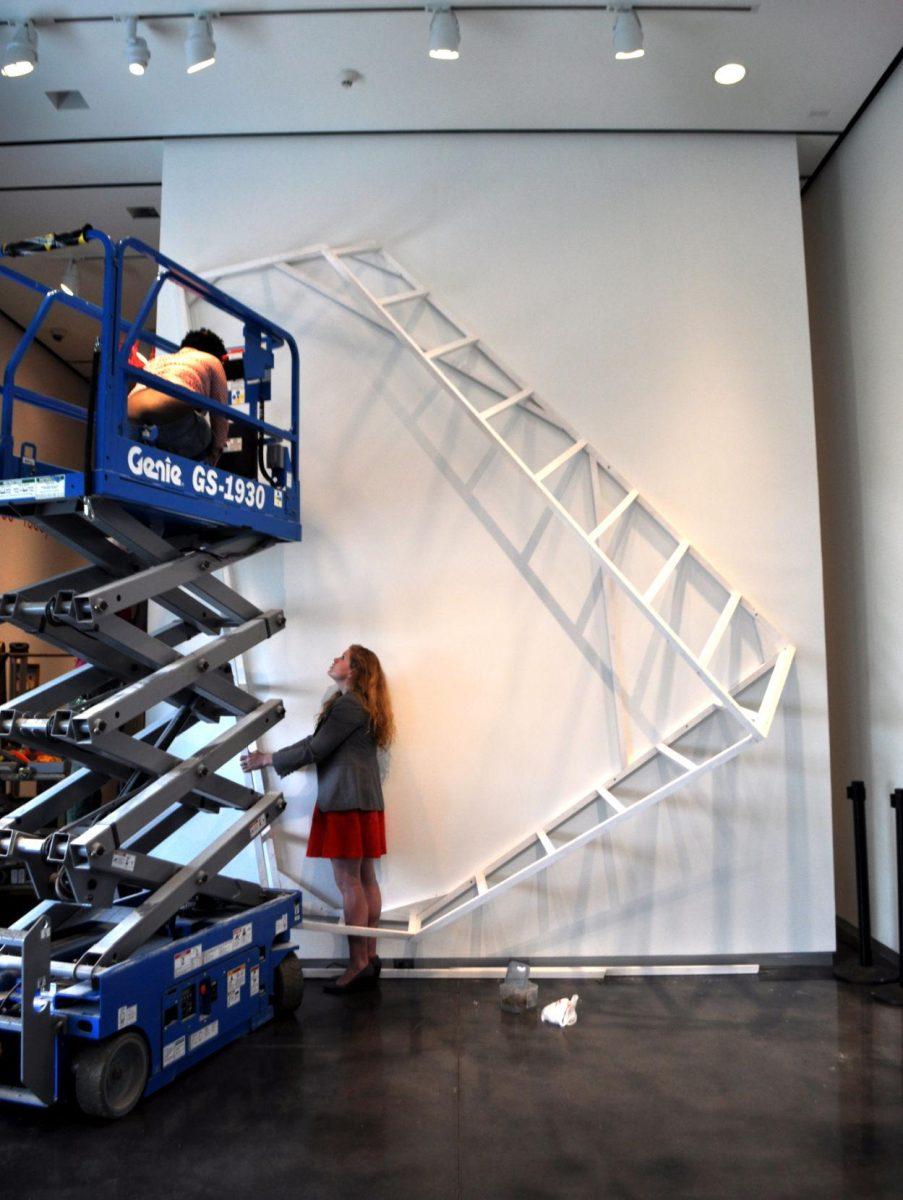 Local artist Silas Breaux works on his new installation, Dwelling, at the LSU Museum of Art on Wednesday.