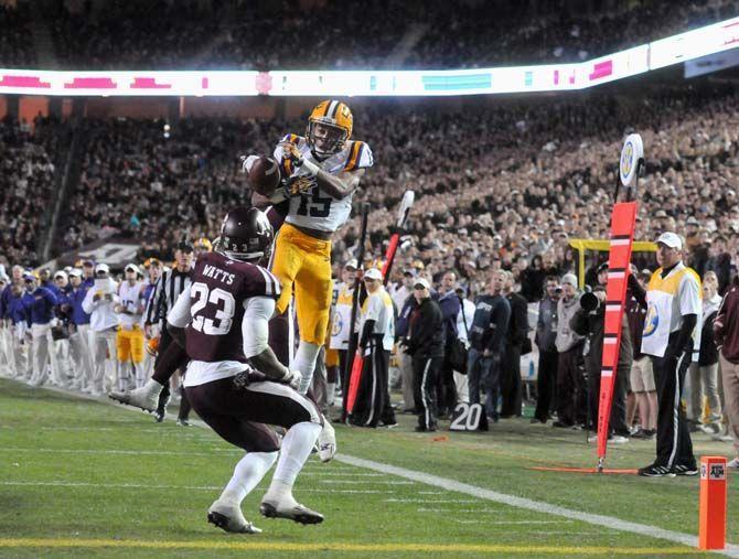 LSU freshman wide receiver, Malachi Dupre (15), misses a pass after being tackled in Kyle Field, College Station on November 27 where the Tigers had a 23-17 victory over Texas A&amp;M.