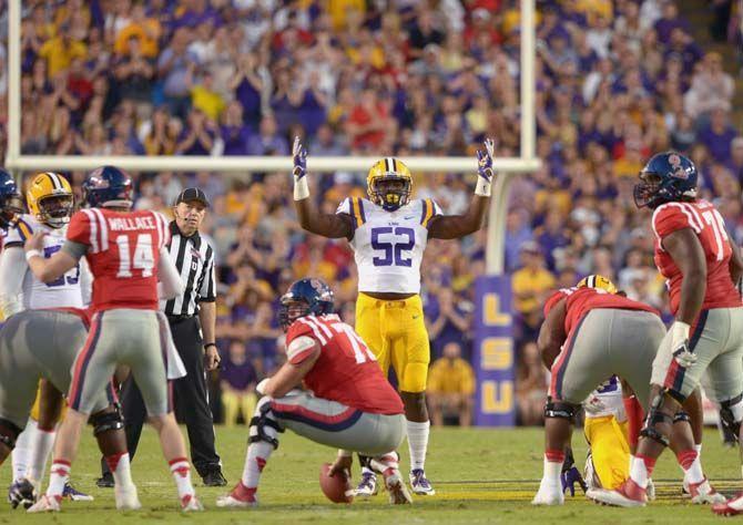 LSU sophomore linebacker Kendell Beckwith (52) pumps up the crowd during Tigers' 10-7 victory against Ole Miss Saturday, October 25, 2014 in the Tiger Stadium.