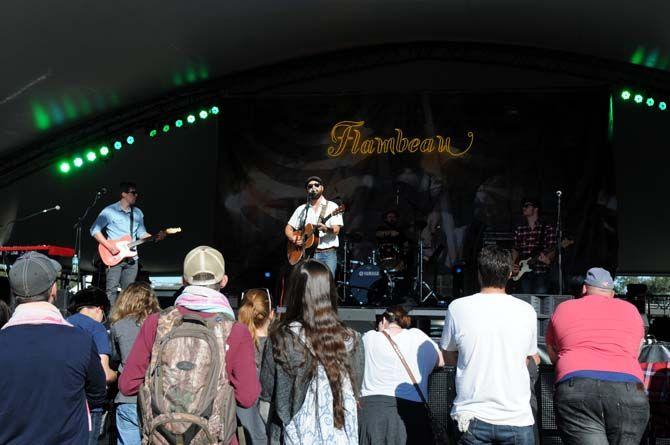 Fans watch as Drew Holcomb and the Neighbors perform on stage Flambeau at Voodoo Music Experience Sunday, November 2, 2014.