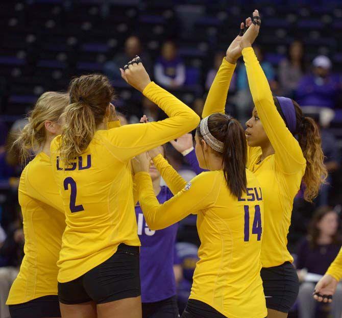 LSU volleyball team cheer before the beging of the game during the Tigers' 3-1 victory over Missouri Friday, Nov. 21, 2014 on the PMAC.